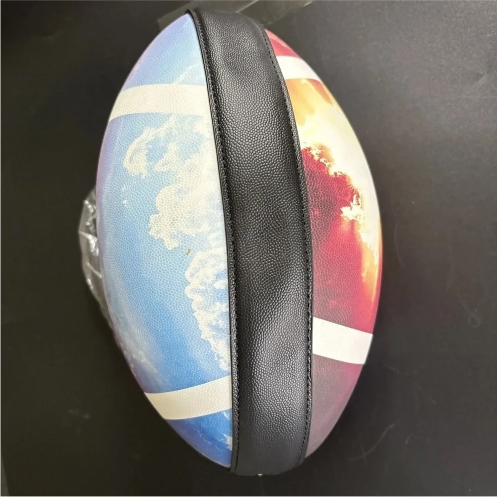 NWT-whimsical tie-dyed clouds  Pristine pebbled Rugby football purse gold chain